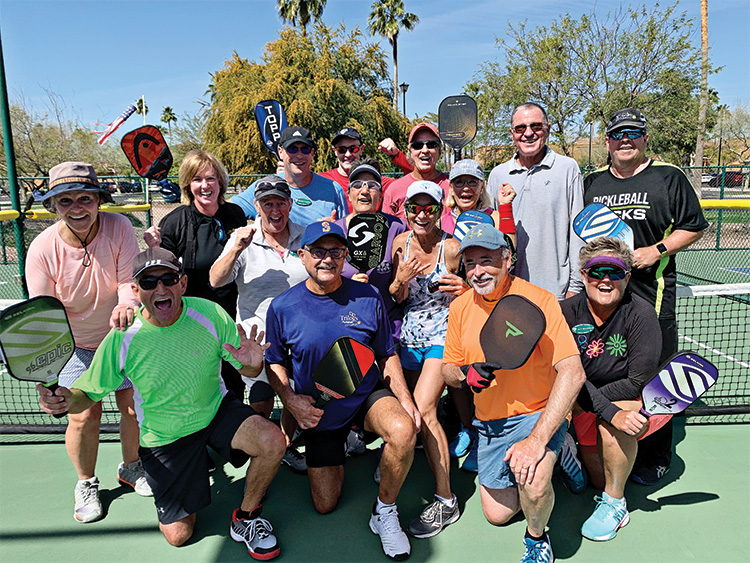 Pickleball players celebrating the announcement that RCI will build additional courts.