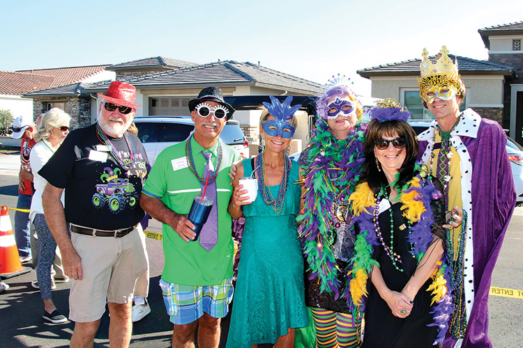 Unit 62B residents: Bob Bolton, Terry and Karen Long, Dave Johnson and Rick Blatnik (King and Queen) and Jill Derkits (Lady in Waiting) enjoy a beautiful and mischievous Mardi Gras Monday on 62Bourbon Street (aka Virginia Avenue). Photo by Dannie Cortez, Cortez Family Photography.