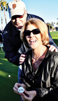 Rotary Club member Jim Frey with PebbleCreek resident Maria Elena Bogwald, winner of $3,000 in the Rotary Club Charity Golf Tournament Ball Drop event