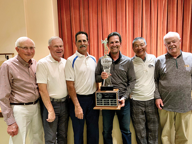 Club champion Norm Post (holding trophy) with PebbleCreek Golf professional staff