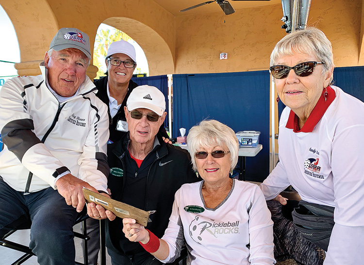 Mike Crabtree (tournament co-director) reviewing scores with certified referees. (Left to right): Terry Brown, Randi Levenbaum, Mike Crabtree, Lynn Plesha, and Sandy Brown