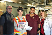 (Left to right): John Moore, PC Dem Club president; Jess Legaspi and Fidel Rodriquez, AFFCB staffers; and Judy Hart, co-chair, Community Benefits Committee with the PC Post at the Food Bank after dropping off a load of food.