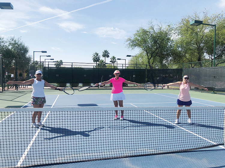 PC tennis players Donna Armbruster, Jo Werner, and Shelley Bain (left to right) were practicing social distancing on the first day of phase one on the Tuscany Falls tennis courts.