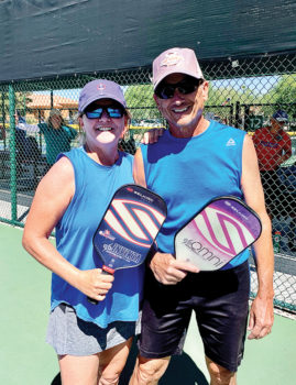 Kim and Gary Mattevi playing mixed doubles on the courts!