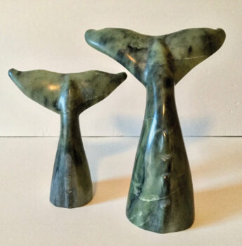 Lyle Chrisman used soapstone to hand carve “Whales Tails.” A soapstone carving is finished by applying hot wax to give the piece a shine.
