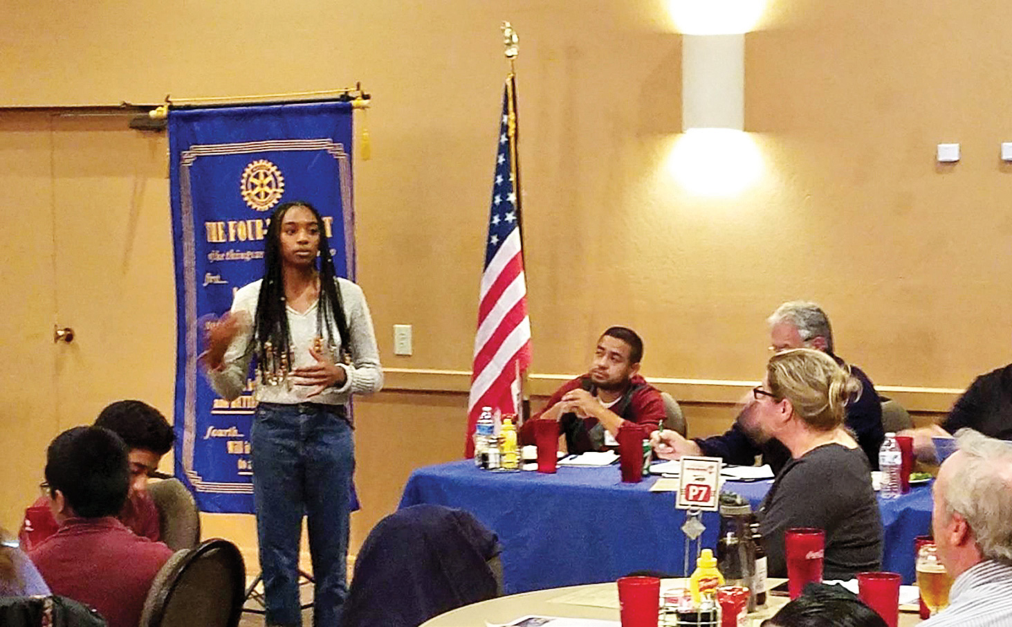 Kyra Horton presents an Interact Club update during a Rotary Club of Surprise meeting.
