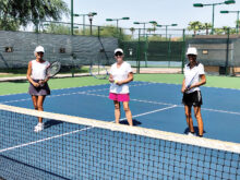 Jo Terry, Norma Whitley, and Jude Tarkowski, out on the courts for some morning exercise.