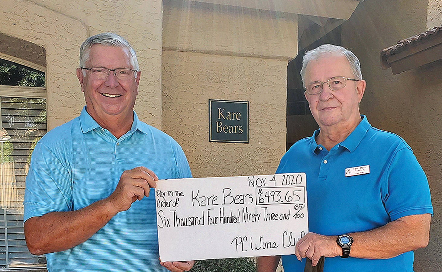 Culver Stone (left), President of the PebbleCreek Wine Club, presented Tom Meek (right), President of the Kare Bears, with a check for $6,493.65 on Nov. 4. That donation brings the PebbleCreek Wine Club’s financial support of Kare Bears, over the last three years, to $26,493.65.
