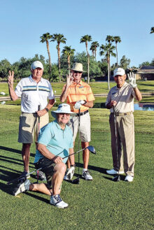 Jim Mitchell watches as Brad Hedien, Chuck Akers, and Joe Belonax get ready for the “Two-Three-Four” Tournament on Sept. 10. Their team tied for second place.