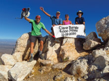 Left to right: Lynn Warren (photographer), Clare Bangs, Marilyn Reynolds, and Mike Tansey celebrating Clare’s achievement on Quartz Peak, where the drive to get there is as challenging as the climb.
