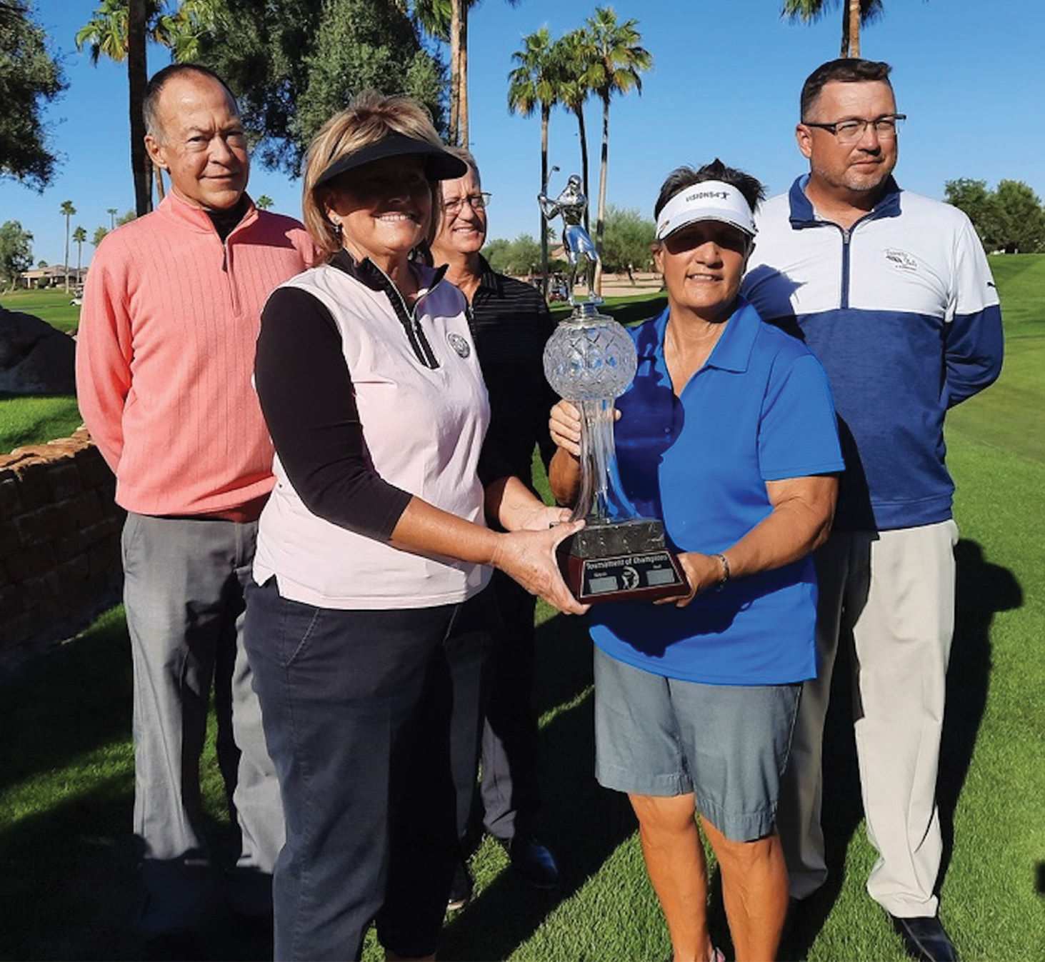 Front row (left to right): Overall Net Champion Nancy Moore and Overall Gross Champion Andrea Dilger; back row: Head Pro John McCahan, David Vader, and Ronnie Decker