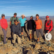Left to right: Marilyn Reynolds, Clare Bangs, Mike Tansey, Eileen Lords-Mosse, Neal Wring, Kris Raczkiewicz, and Lynn Warren (photographer) enjoying 360-degree views from the summit of Saddle Mountain.