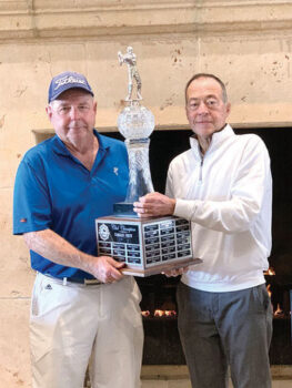 John McCahan (right) presents the club championship trophy to Jack Schafer